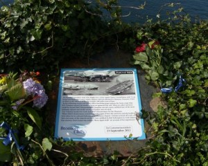 Memorial Plaque secure and surrounded by ivy and flowers on Bromore Cliffs